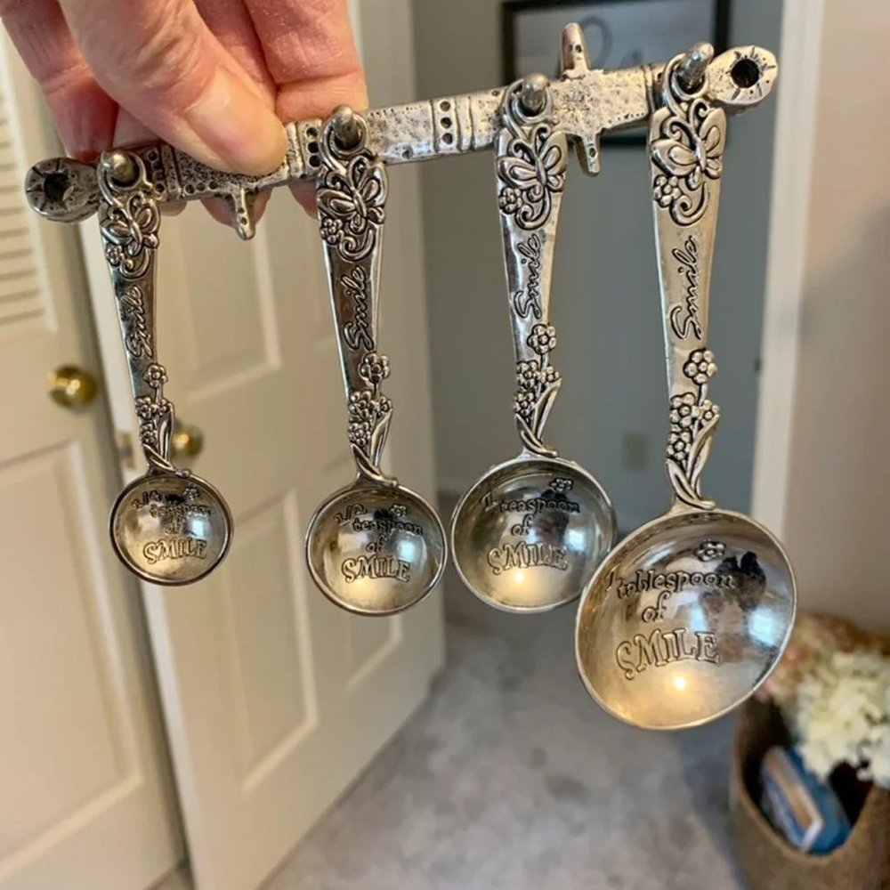 Pewter vintage measuring spoons with wall holder
